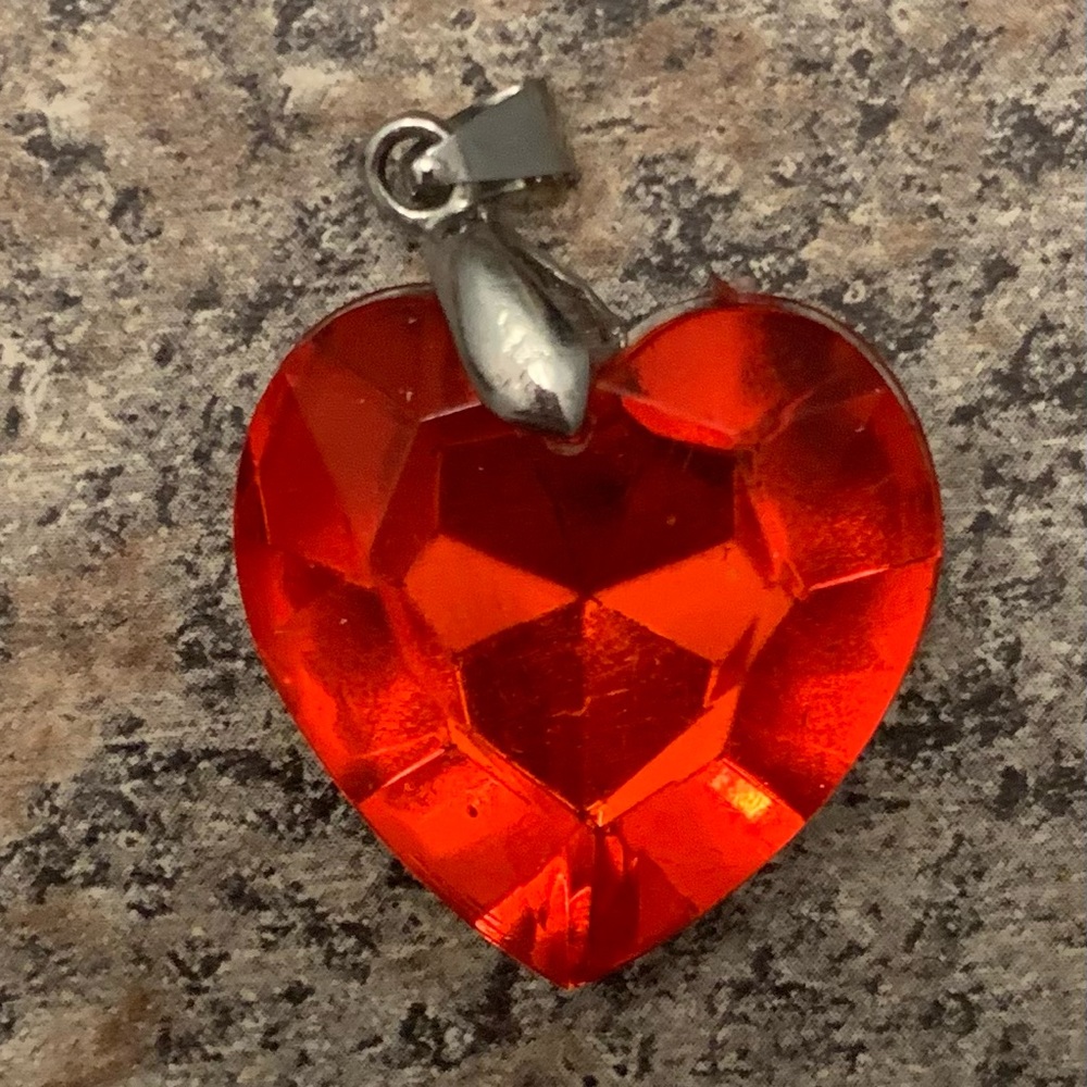 Two bracelets and a heart charm